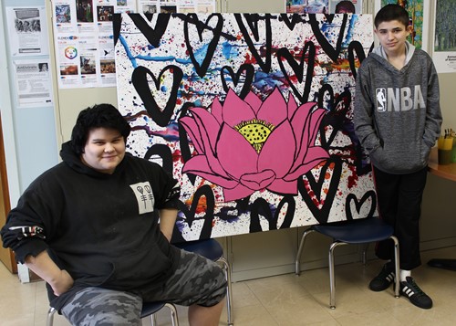 Ridgecrest Academy artists Calvin King (l) and Jonathan Finger (r) with their still-incomplete painting for Rochester’s Ronald McDonald House.