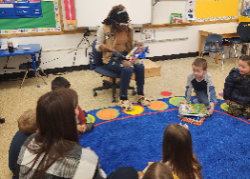Volunteer reading to preschoolers