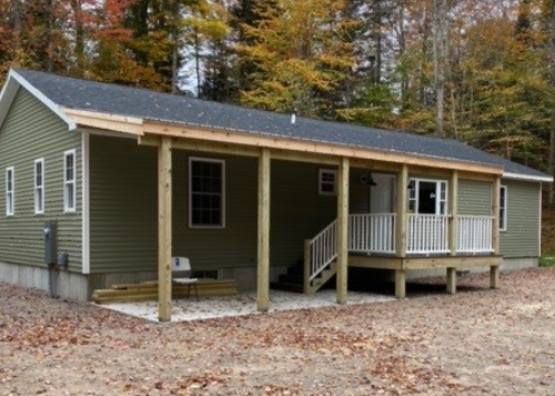 exterior of student-built home on new land