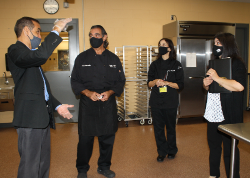 Andy Bailey, Chef Mike Mirabella, Chef Carol Lupisella, and Carmen Bailey in one of WEMOCO's Culinary labs. 