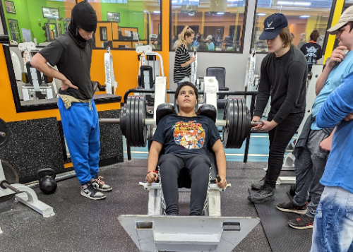 Students working on fitness equipment