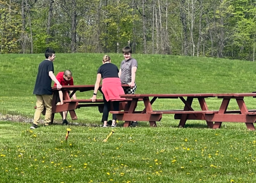 Our group moving picnic tables into place