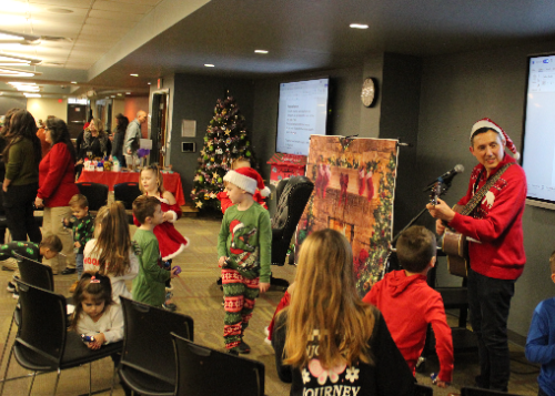 Children singing and dancing at the event