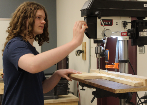 Student learning woodworking