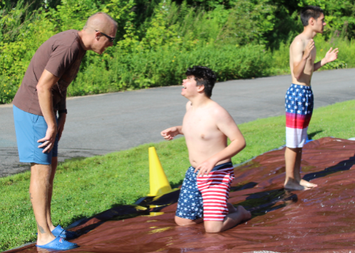 Student and teacher laughing with each other on Water Day