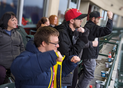 Group watching the game from a balcony