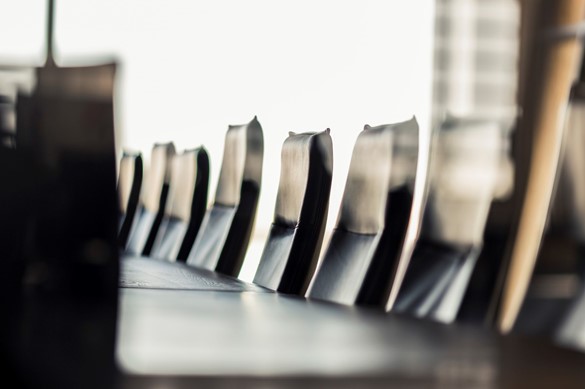 Empty table and chairs in board room at office 