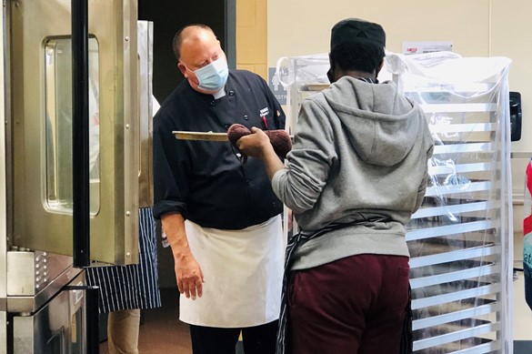 Chef and CTE student in the bakery
