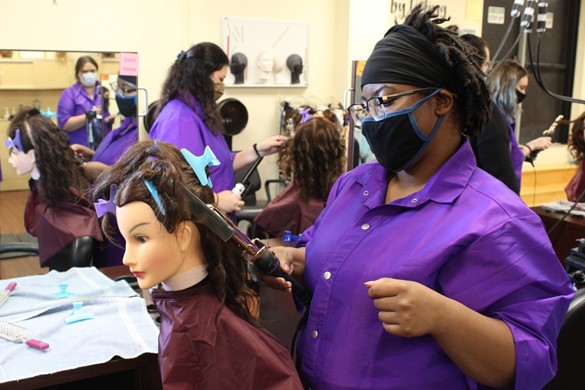 Students at CTE styling hair