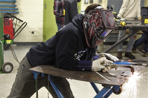 Student welding at CTE