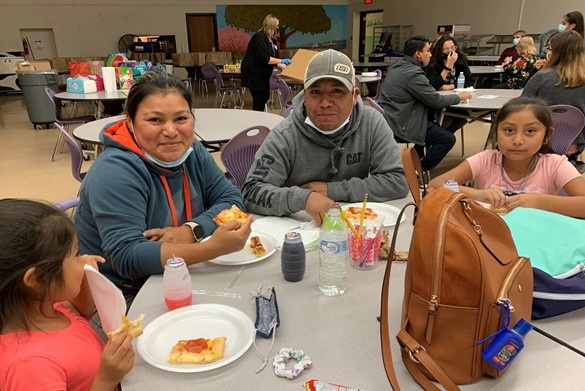 Family eating pizza