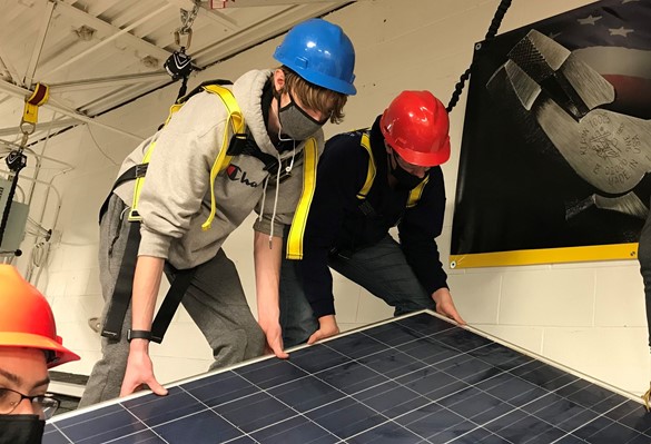 CTE students installing solar panel