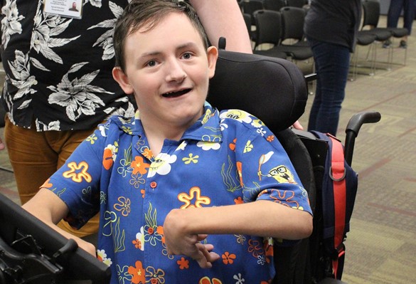 Smiling student wearing tropical Sponge Bob shirt