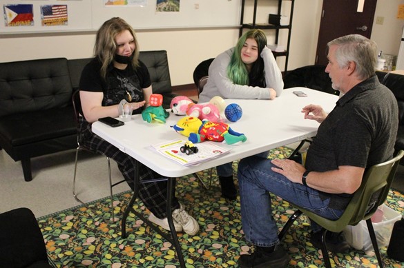Two students learning Spanish with teacher at Westside Academy