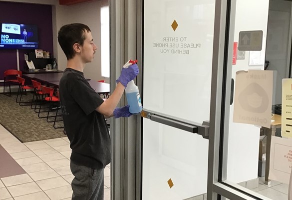 Student cleaning at CATS office