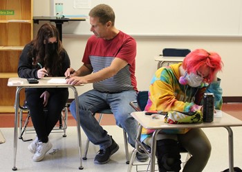 Westside teacher working with student