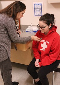 Nurse with student 