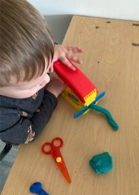 Student with modeling dough