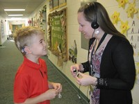 Audiologist working with student
