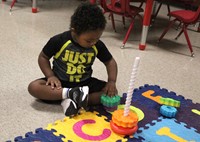 Preschool student playing