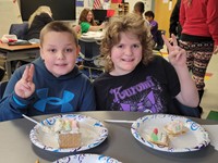 Two students smiling